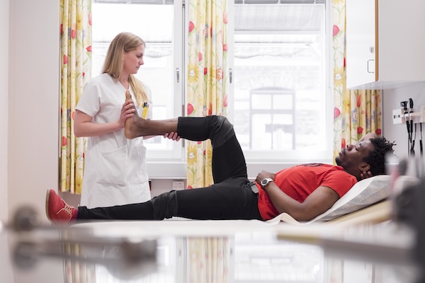 Physiotherapy session showing leg treatment and rehabilitation